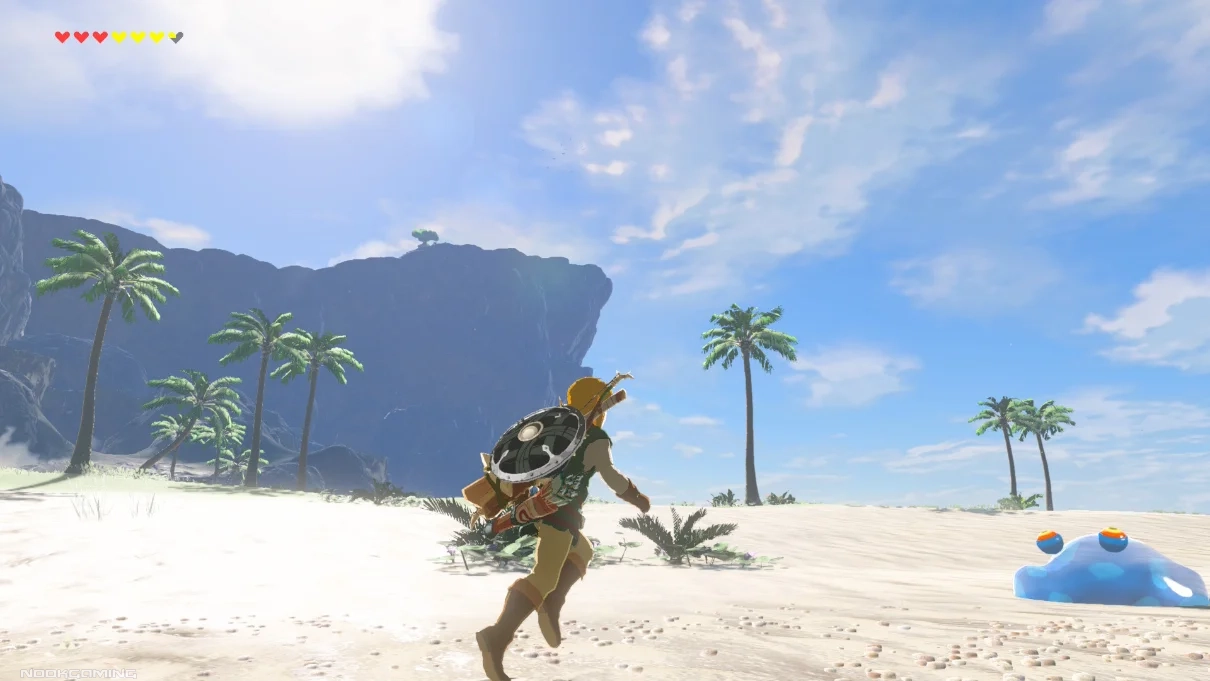 Link navigating a sandy beach