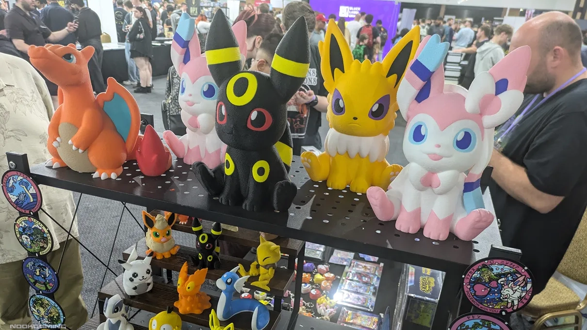 A set of Eeveelution (plus Charizard) plushes at Birmingham Card Show