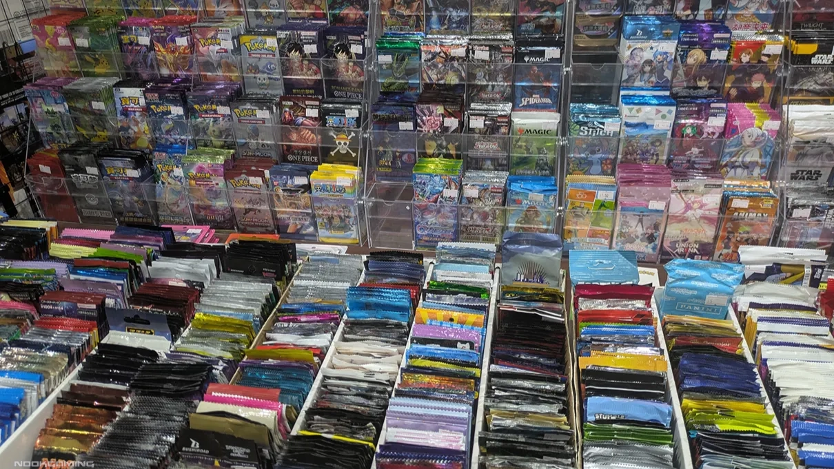 A variety of packs of cards from an assortment of card games for sale